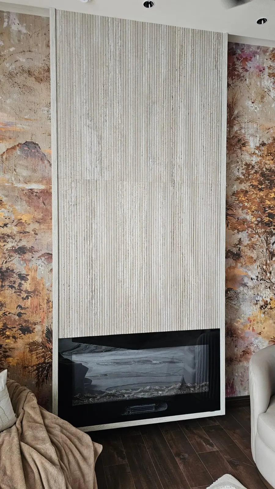Dekton fluted cladding surrounding a linear fireplace