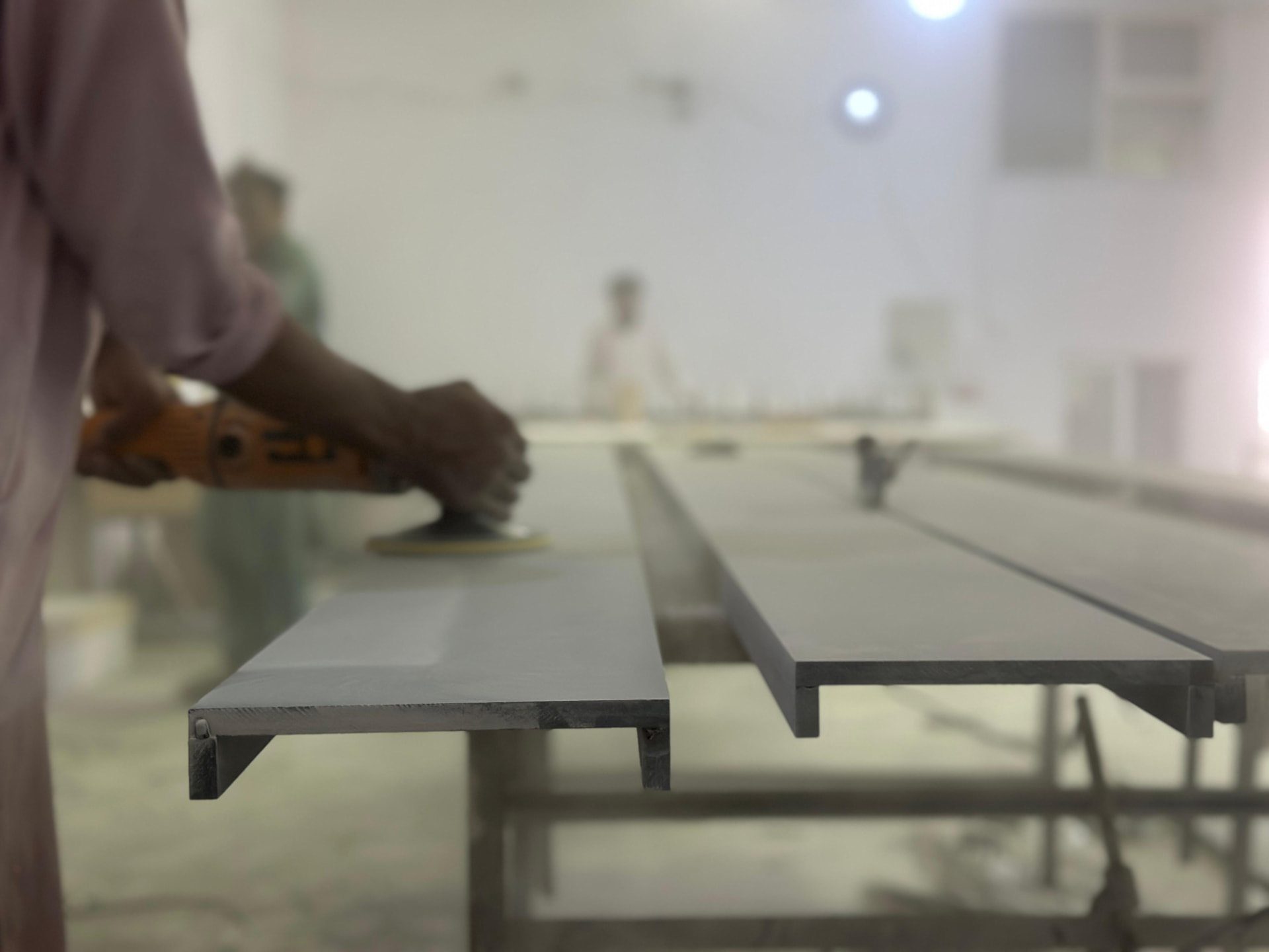 Sanding a solid-surface panel edge to a seamless finish